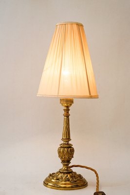 Traditional Table Lamp: Antique Finish with Curved Arms and Pleated Shade