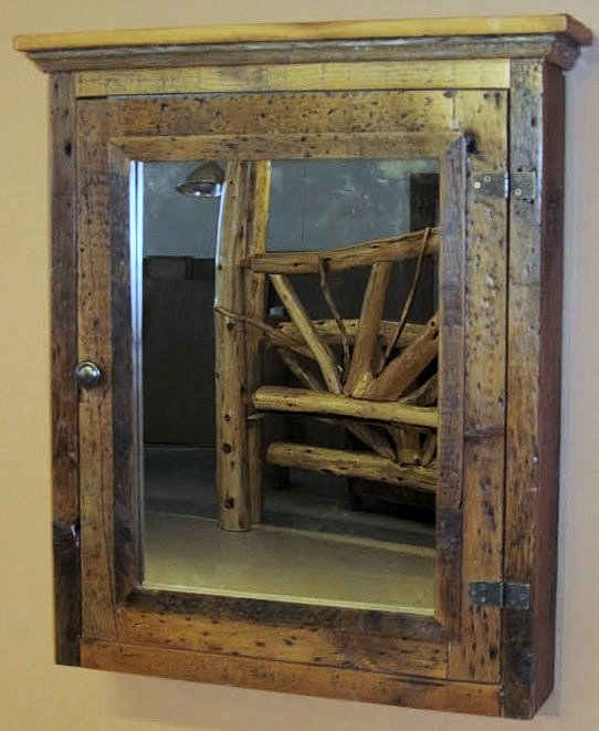 Weathered Wood Medicine Cabinet with Three-Panel Mirror Design