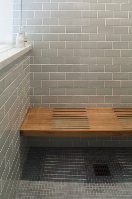 Wooden Shower Bench Styled with Vibrant Blue Tile and Recessed Niche