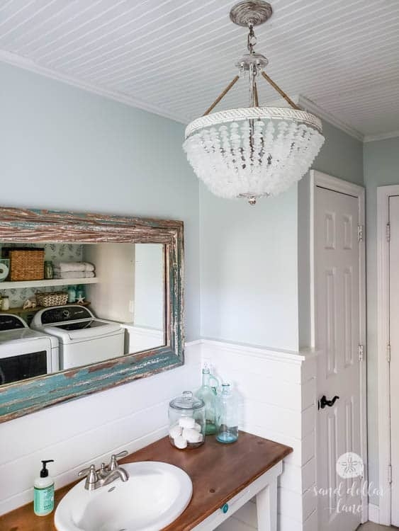 Chandelier Beaded Empire Coastal Bathroom With Freestanding Tub