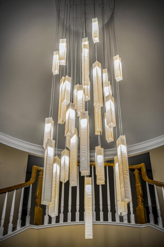 Chandelier Cascading Multi-Light Spheres for High Ceiling Spaces.