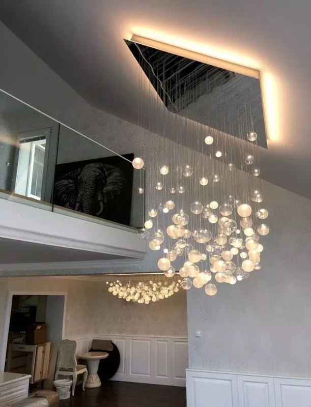 Chandelier featuring Cascading Strands and Sloped Ceiling Base