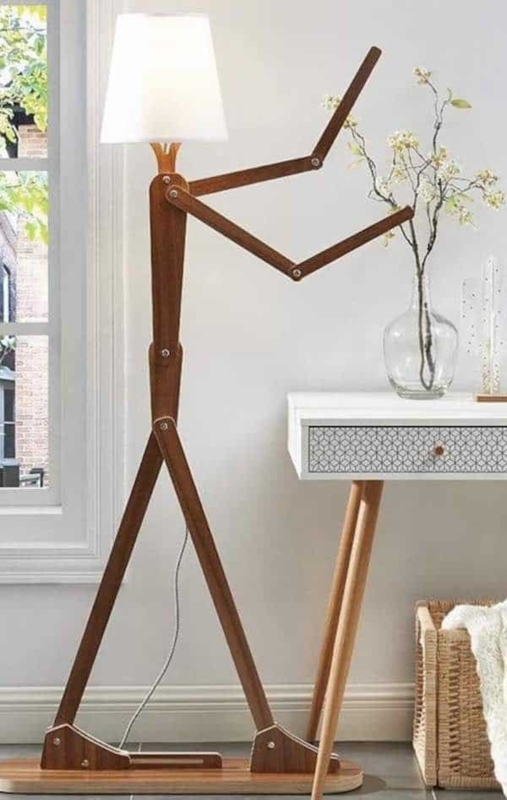 Floor Lamp: Black Human Silhouette Form Holding an Opal Glass Globe