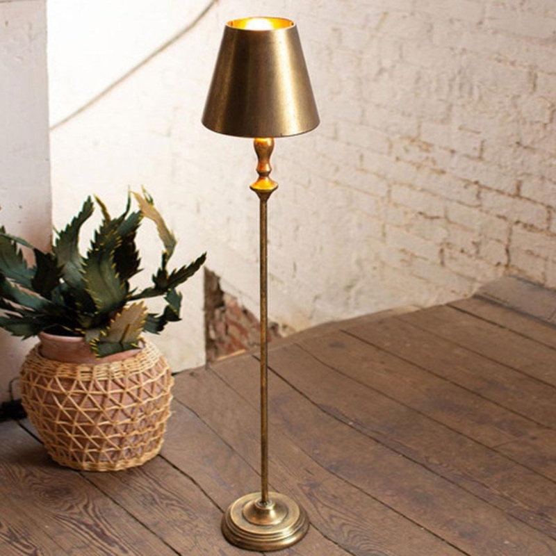 Floor Lamp featuring antique gold tripod base and drum shade.