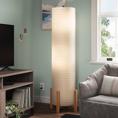 Floor Lamp: Scandinavian Style, Light Wood Tripod Legs, Ribbed Shade.