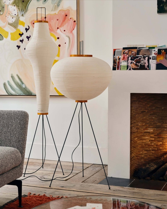 Floor Lamp: Sculptural Ribbed Cream Washi Shade, Black Metal Tripod Legs.