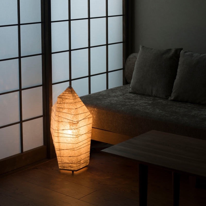Floor Lamp: Sculptural Stacked Stone Silhouette, Textured Washi Paper.