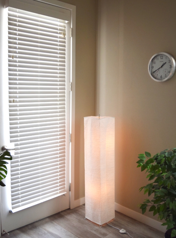 Floor Lamp: White Crepe Paper Shade, Column Silhouette, Matte Black Base.