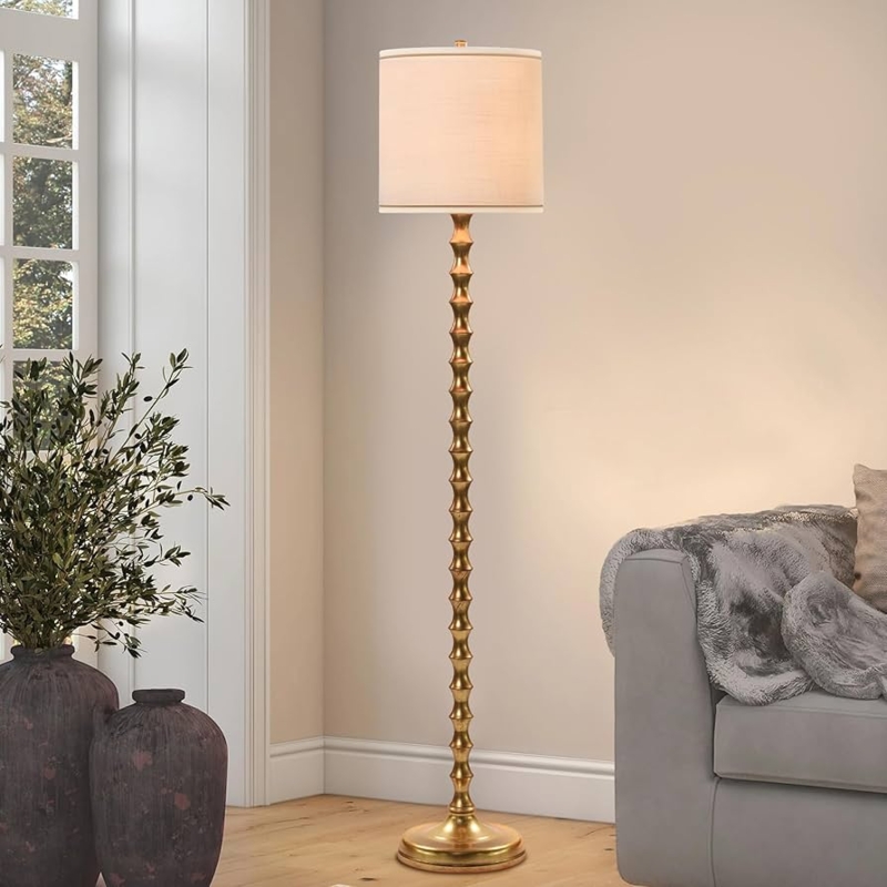Floor Lamp with bamboo-inspired stem, polished finish, and drum shade.