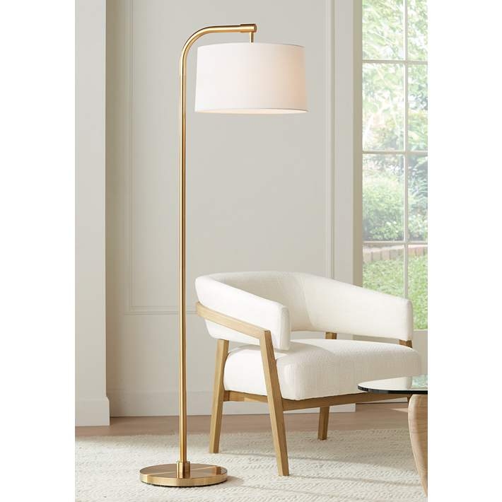 Floor Lamp with offset arm, warm finish, and drum shade.