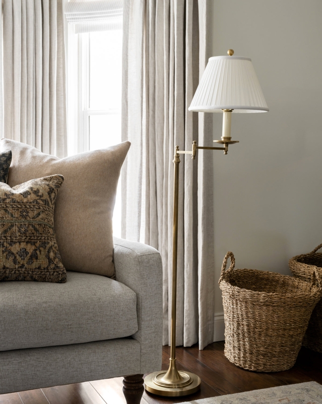 Matte Black Floor Lamp Styled with Cozy Woven Accent Chair