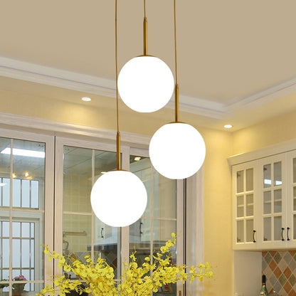 Pendant Light Cluster with White Glass Globes and Brushed Brass Stems