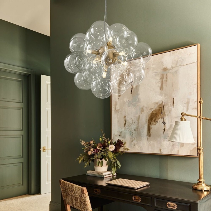 Six Light Brass Cluster Chandelier with Clear Bubble Spheres.