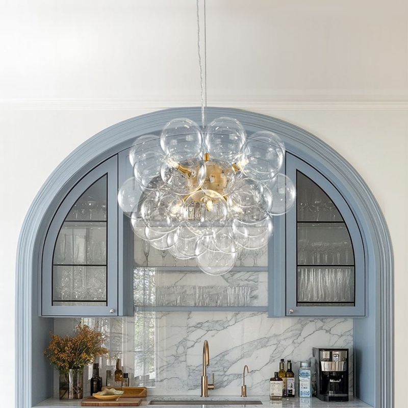 Staggered Glass Sphere Cluster Chandelier in Polished Brass.
