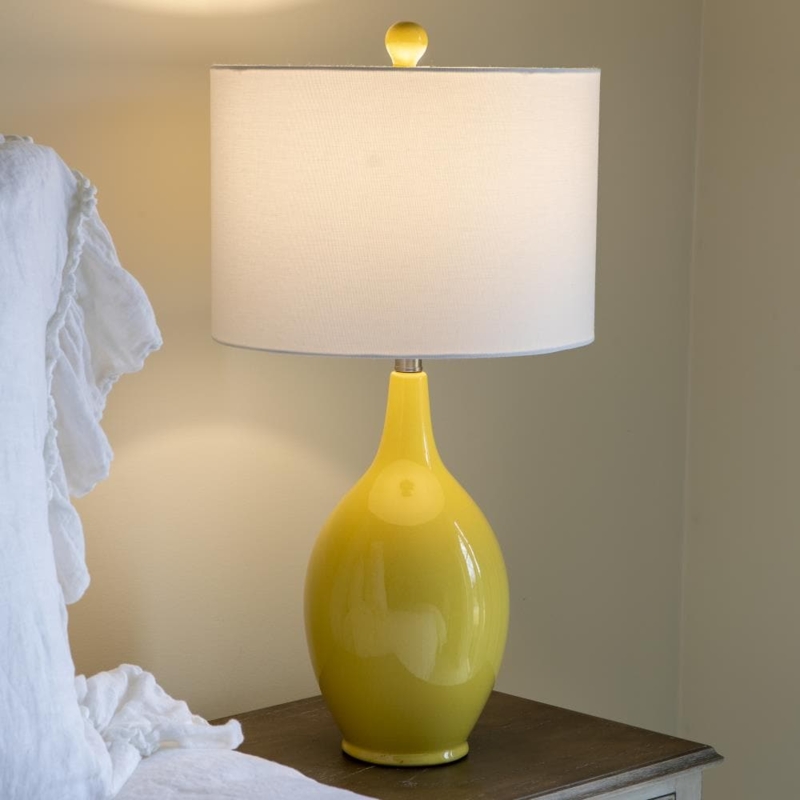 Table Lamp: Soft Yellow Ceramic Ovoid Base with Linen Drum Shade.