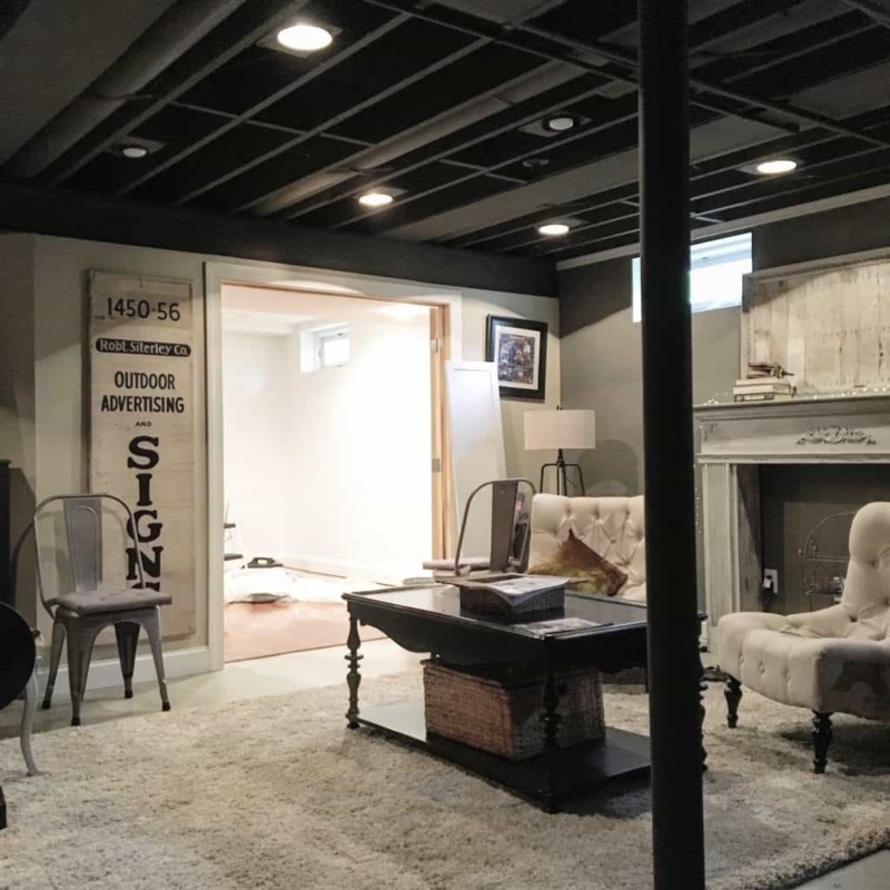 Accent Chairs in Basement Lounge with Oversized Vintage Sign Wall Art