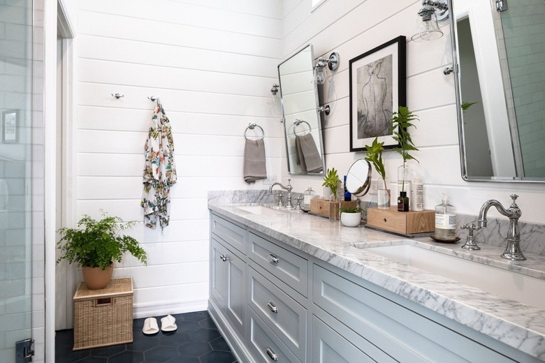 Airy Farmhouse Bathroom featuring Grey Vanity and Dark Hexagonal Tiles