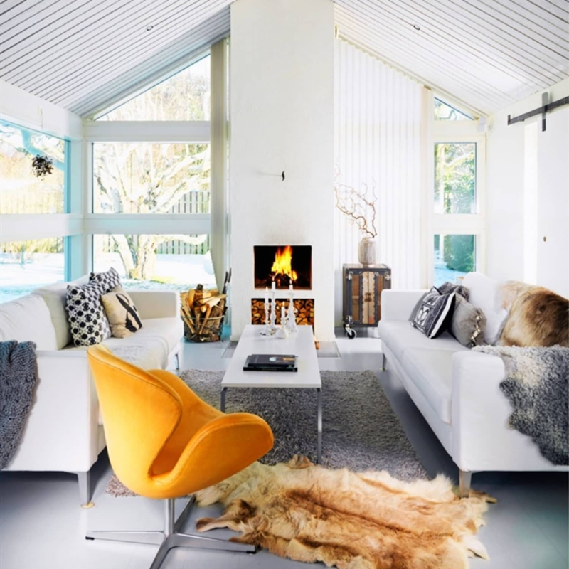 Airy Vaulted Ceiling Living Room with Yellow Swan Chair & Fireplace