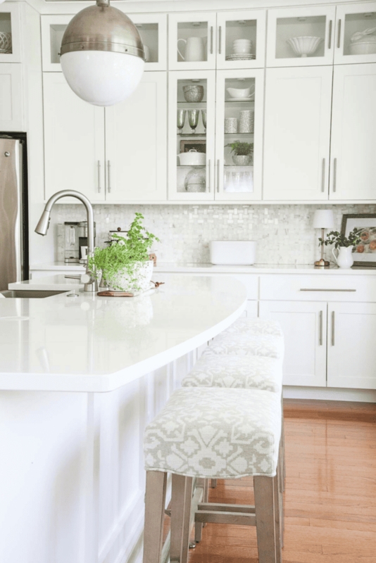 All-White Kitchen Styling with a Unique Curved Breakfast Bar Layout
