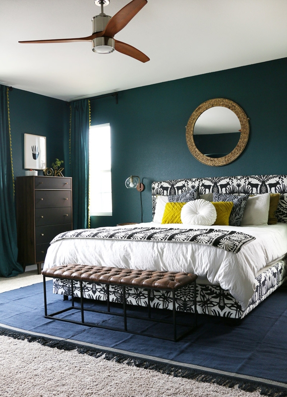 Animal Print Upholstered Bed with Dark Teal Accent Wall