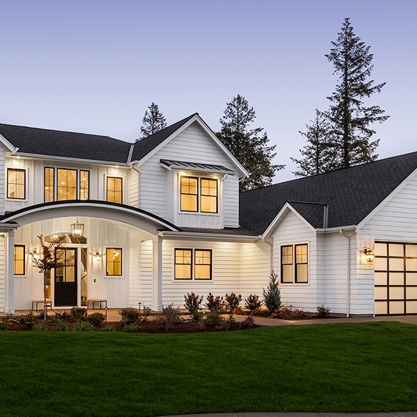 Arched Front Porch Design on Farmhouse with Frosted Glass Garage