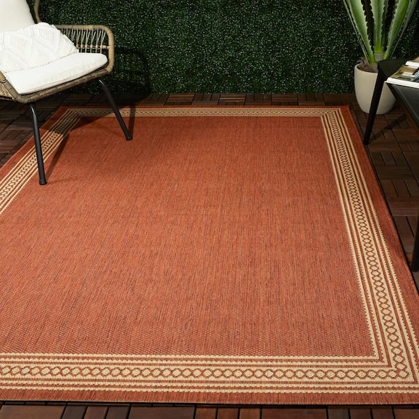 Area Rug Contrasting Border Rust and Tan Low Pile Patio Dining Idea