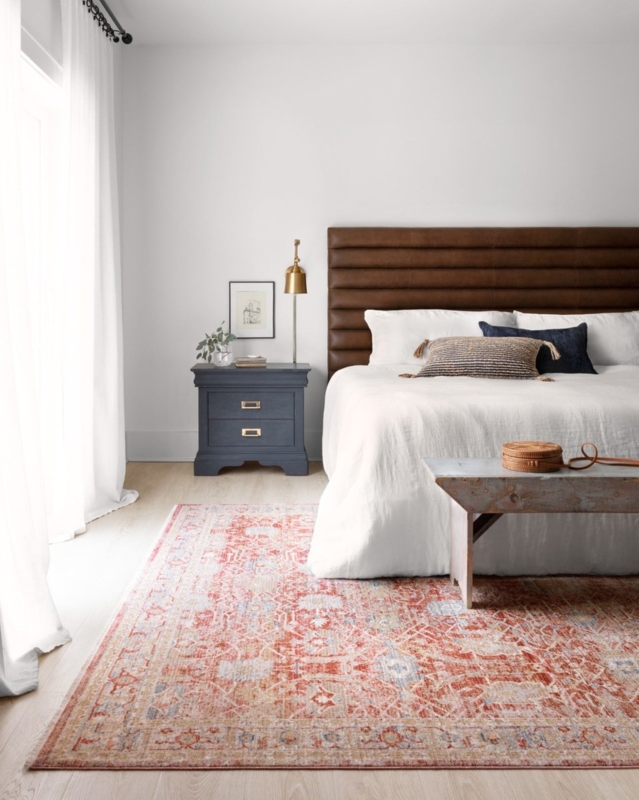 Area Rug in Faded Terracotta and Cream with Horizontal Channel Tufting.