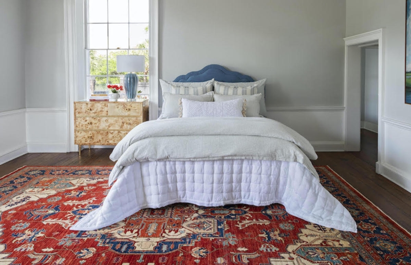 Area Rug in Traditional Red Oriental Print with Scalloped Headboard.