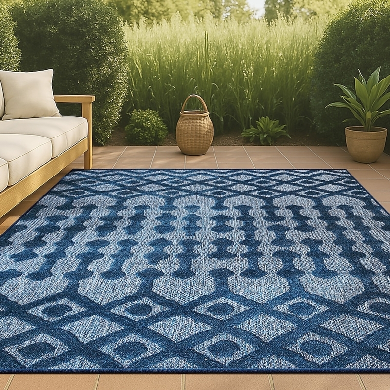 Area Rug: Navy Diamond Pattern Anchors Wicker Patio Furniture