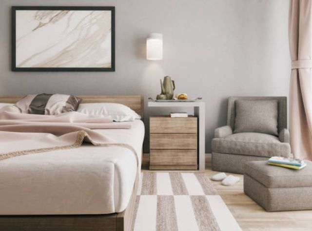 Armchair and Ottoman Set with a C-Table in a Contemporary Bedroom