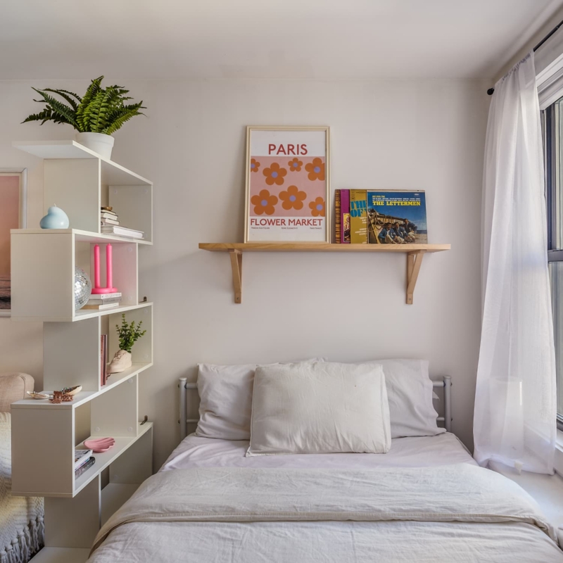 Asymmetrical White Shelving Unit as Room Divider in Small Bedroom