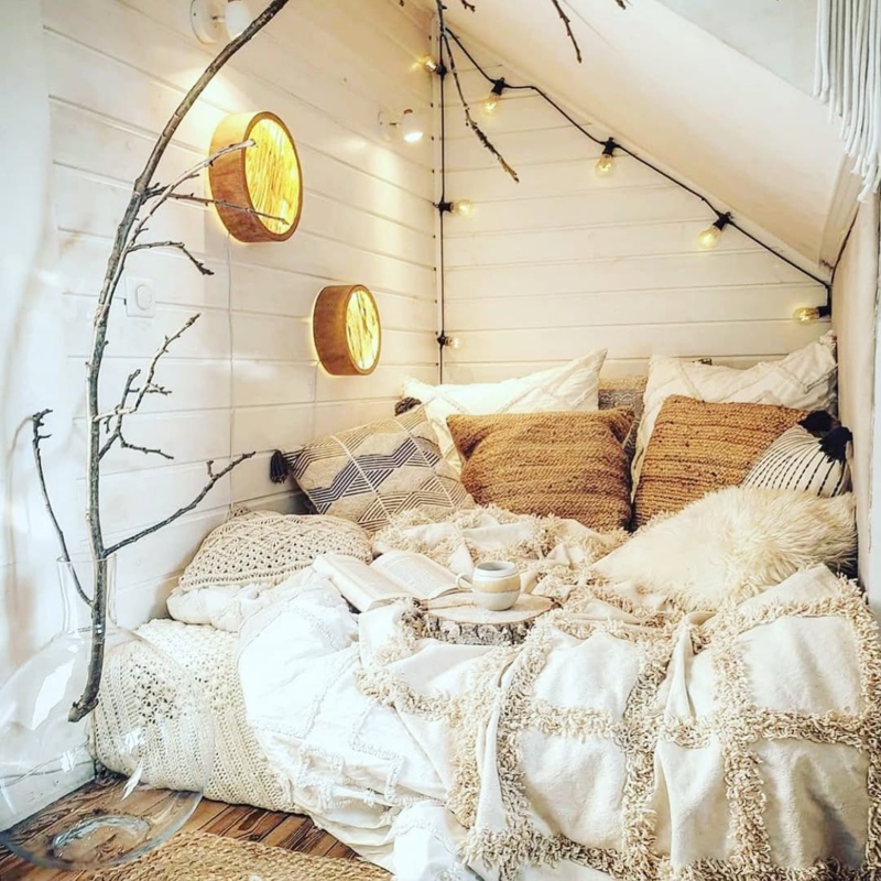 Attic Floor Bed Nook with String Lights & Circular Wood Sconces