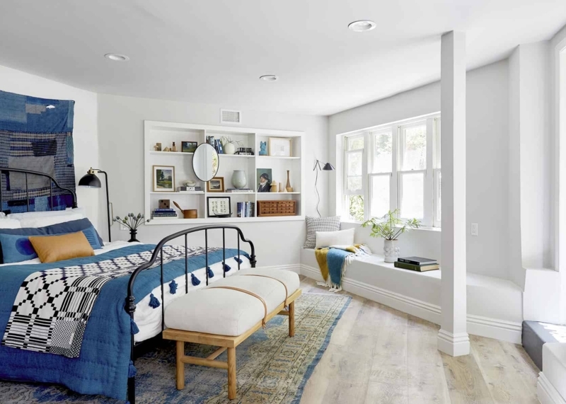 Basement Bedroom Suite with Built-In Wall Niche and Indigo Blue Bedding