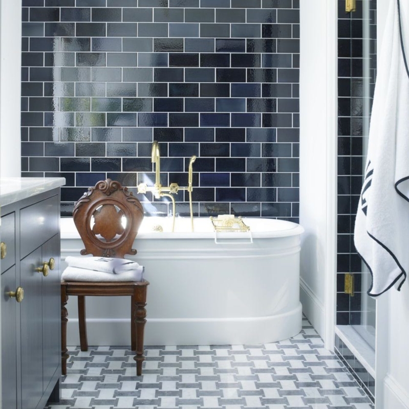 Bathroom featuring Navy Subway Tile Walls and Freestanding Tub