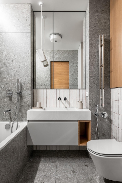 Bathroom featuring Vertical Stack Tile Backsplash and Wood Niche