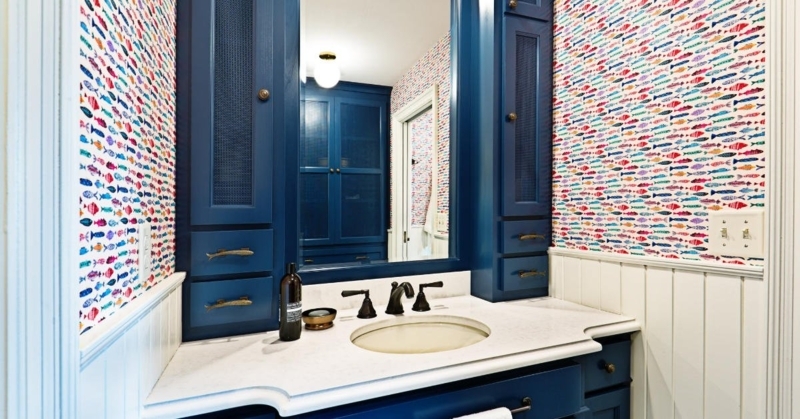 Bathroom Vanity: Deep Blue Cabinetry with Fish Pattern Wallpaper