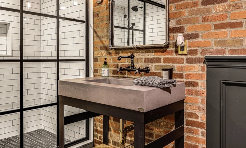 Bathroom Vanity Example with Concrete Trough Sink and Exposed Brick Wall