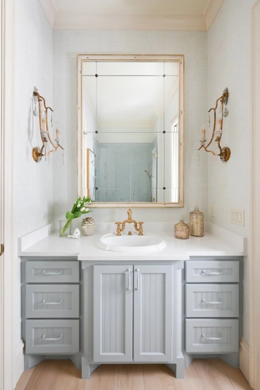 Bathroom Vanity in Light Blue with Gold Bridge Faucet and Beadboard