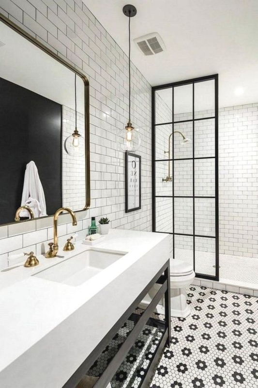 Bathroom Vanity Styling with Brass Faucets and Patterned Hex Floor