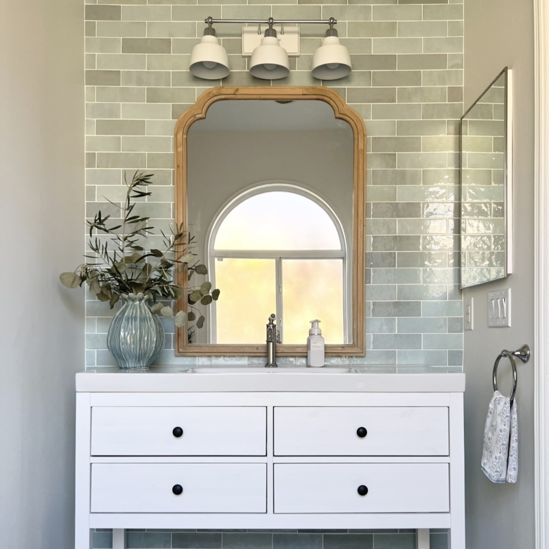 Bathroom Vanity with Arched Wood Mirror and Glossy Sage Subway Tile