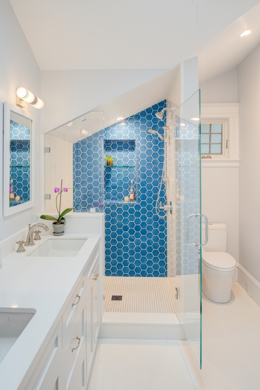 Bathroom Vanity with Blue Hexagon Tile Shower Accent Wall
