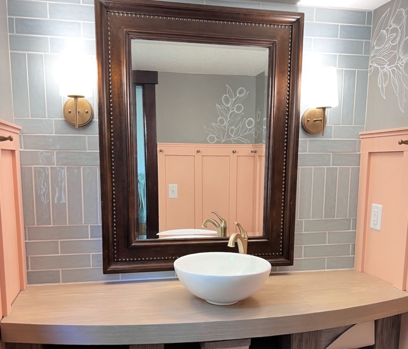 Bathroom Vanity with Blue Subway Tile and Peach Wainscoting Accent