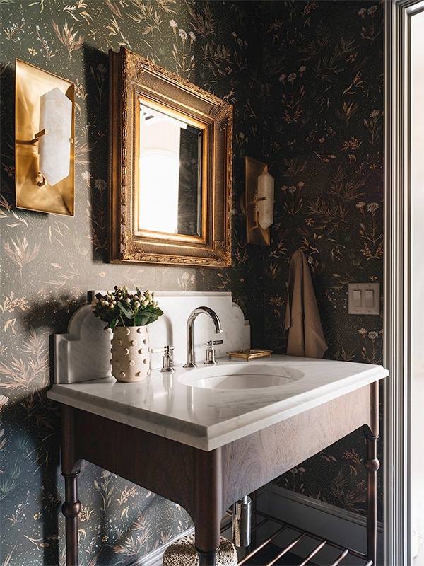 Bathroom Vanity with Dark Botanical Wallpaper and Ornate Gold Mirror