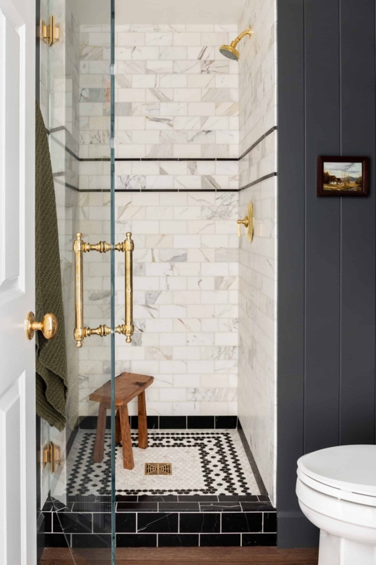 Bathroom Walk-In Shower: Patterned Mosaic Floor and Brass Fixtures