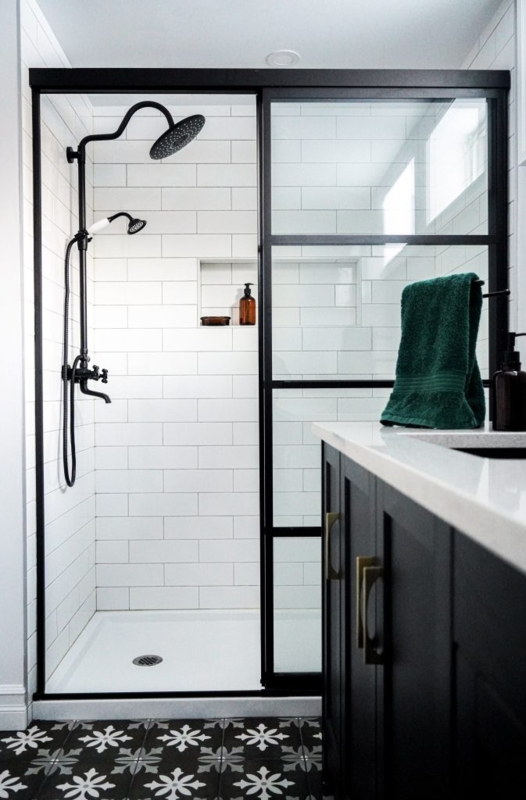 Bathroom with Black Framed Shower Door, Subway Tile and Patterned Floor