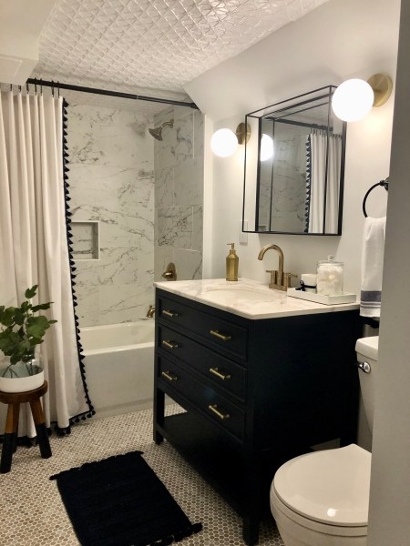 Bathroom with Black Vanity, Gold Hardware and Penny Tile Flooring Ideas