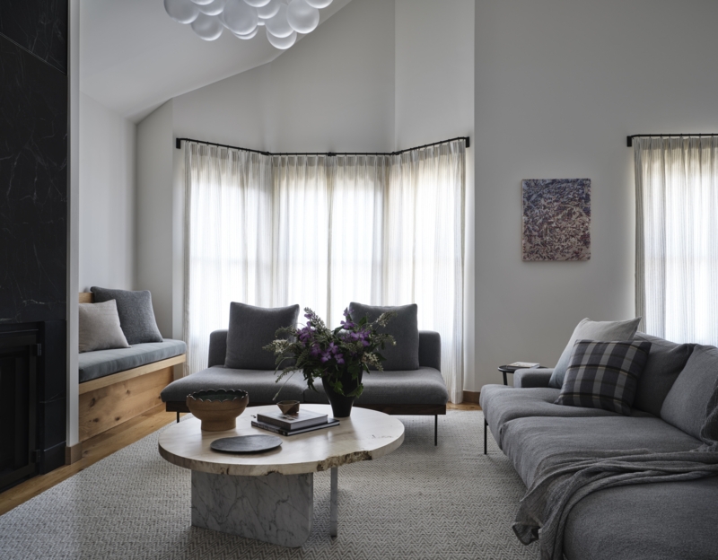 Bay Window Living Room with Built-in Bench and Stone Table