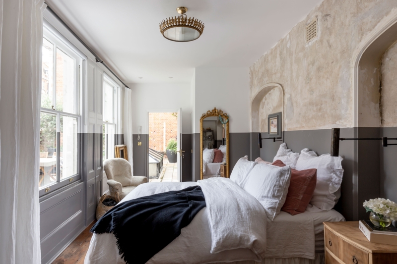 Bed against Distressed Charcoal and White Two Tone Bedroom Wall Ideas