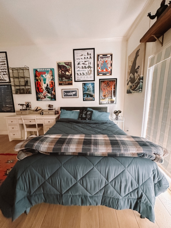 Bed featuring Slate Blue Diamond Quilting and Monster Movie Gallery Wall