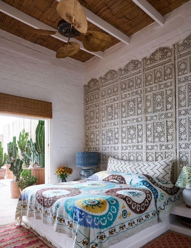 Bed with Carved Screen Headboard and Woven Leaf Ceiling Fan